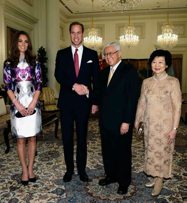 Britain's Prince William shakes hands with...