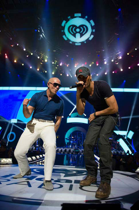 Pitbull and Enrique Iglesias perform onstage...