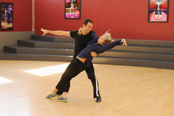 Helio Castroneves and Chelsie Hightower appear...