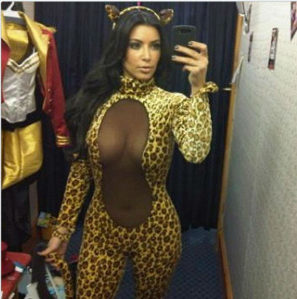 Kim Kardashian appears in a photo posted on her official Twitter page on October 13, 2012, with the caption, 'Rawwwr!!! Halloween Costume shopping.'