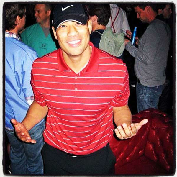 Michael Yo appears dresses as Tiger Woods in a...