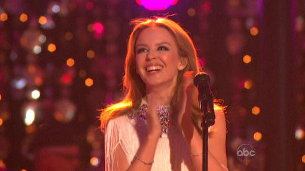 Kylie Minogue sang 'Locomotion' accompanied by...