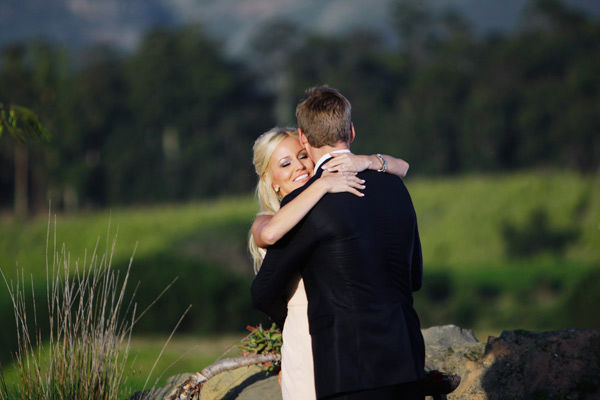 Brad Womack hugs his fiance Emily Maynard on the...