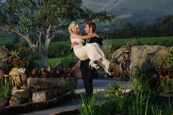 Brad Womack carries his future wife, Emily...