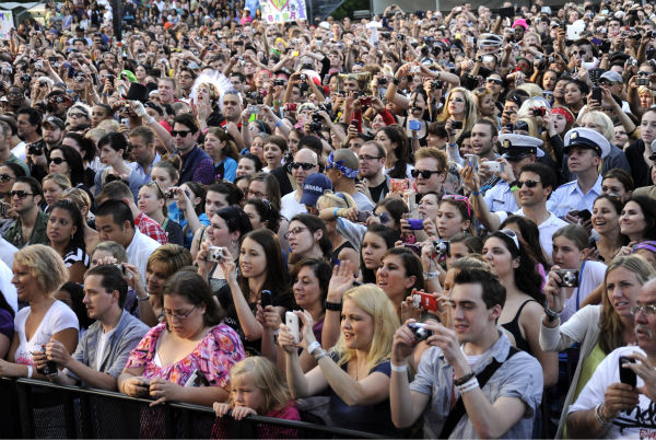 Fans watch Lady Gaga performing live in Central...