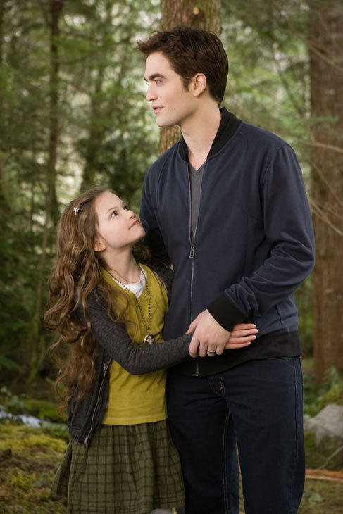 Taylor Lautner and Mackenzie Foy appear in a...