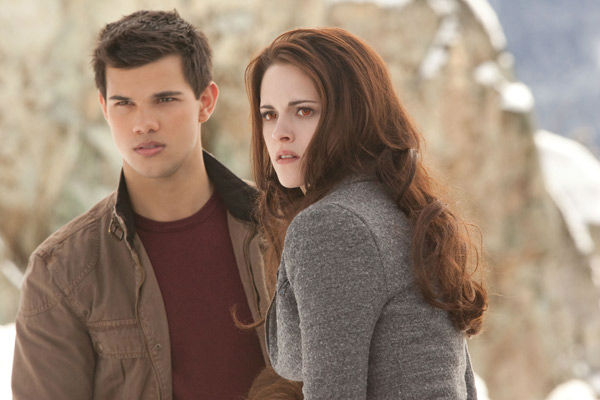 Taylor Lautner and Kristen Stewart appear in a...