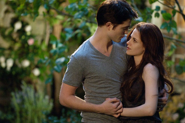 Kristen Stewart and Robert Pattinson appear in a...
