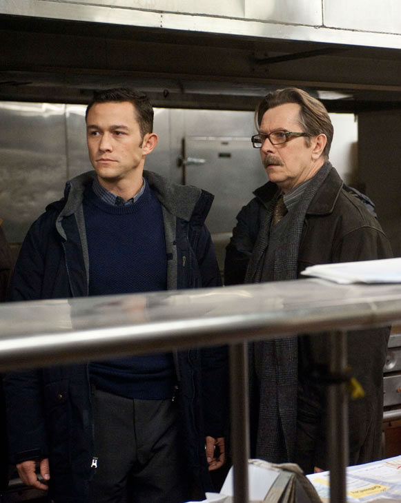 Joseph Gordon Levitt appears as John Blake and...