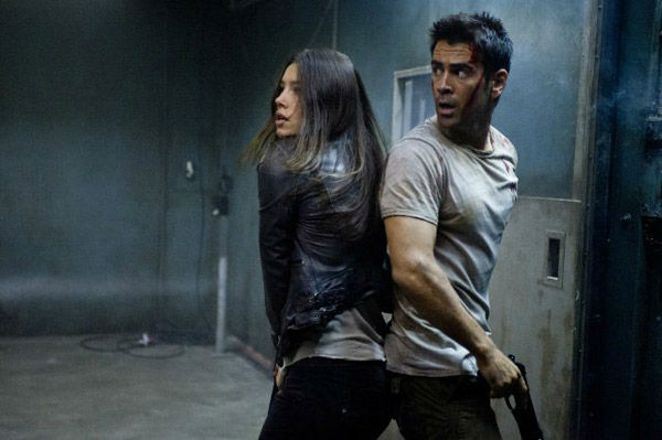 Jessica Biel and Colin Farrell appear in a still...
