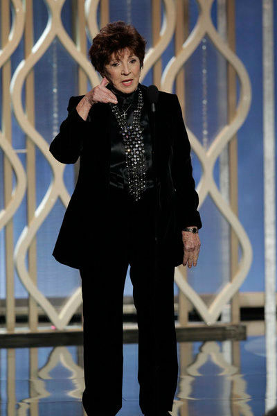 Pictured: Dr. Aida Takia-O'Reilly on stage...