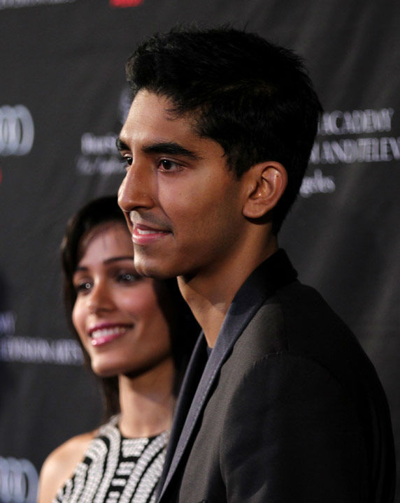 Actors Dev Patel, right, and Freida Pinto arrive...