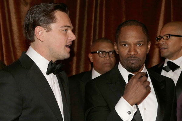 Actors Leonardo DiCaprio and Jamie Foxx attend...