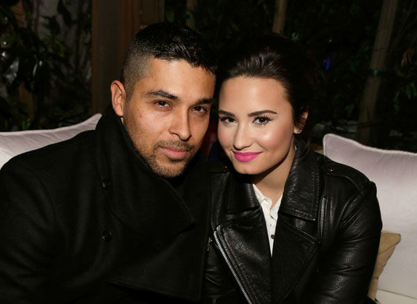 Actor Wilmer Valderrama (L) and singer Demi...