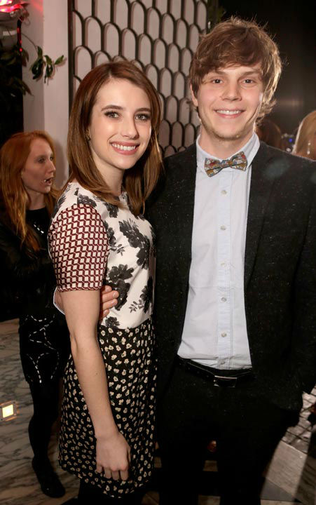 Actors Emma Roberts (L) and Evan Peters attend...