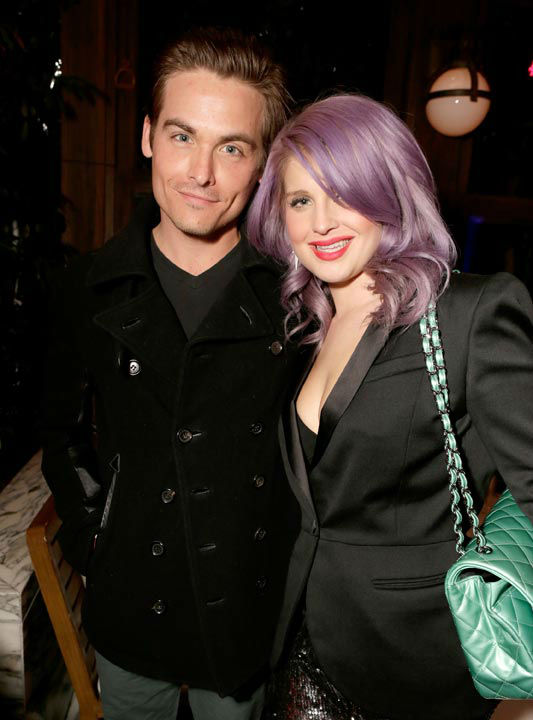 Actor Kevin Zegers and Kelly Osborne wearing Topshop attend the Topshop Topman LA Opening Party at Cecconi's West Hollywood on February 13, 2013 in Los Angeles, California.