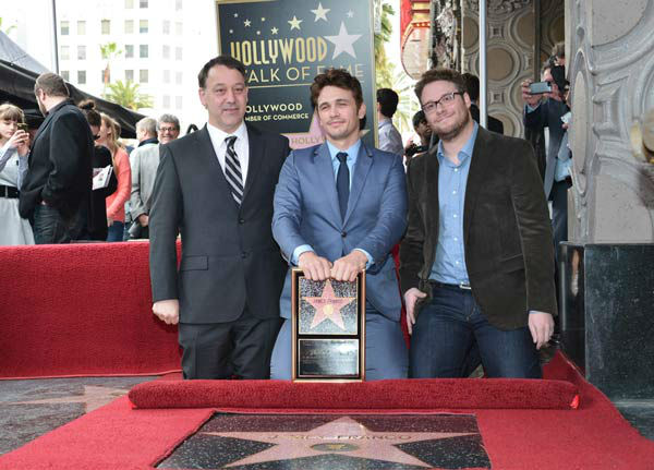 (L-R) Director Sam Raimi, actors James Franco...