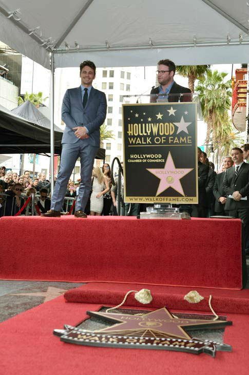 Actors James Franco (L) and Seth Rogen speak...
