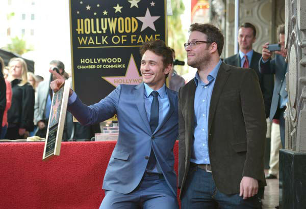 Actors James Franco (L) and Seth Rogen attend a...