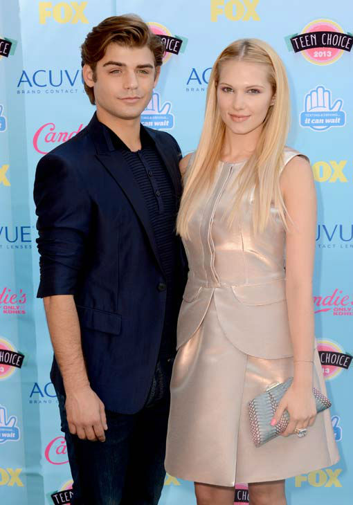 Garrett Clayton, left, and Claudia Lee arrives...