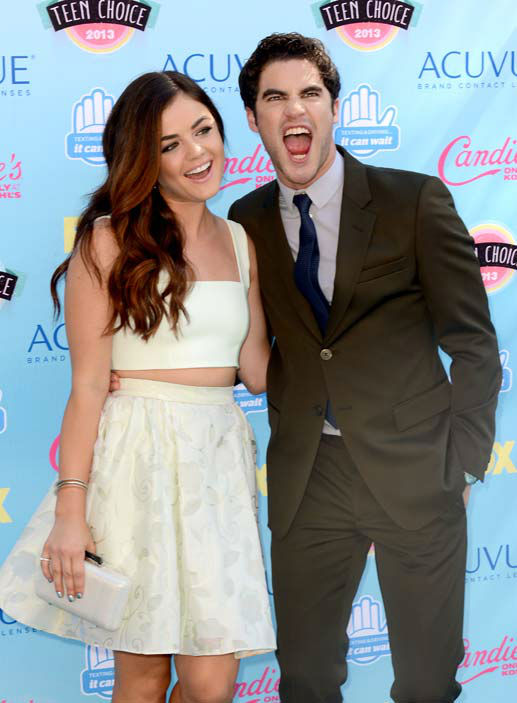 Lucy Hale, left, and Darren Criss arrive at the...