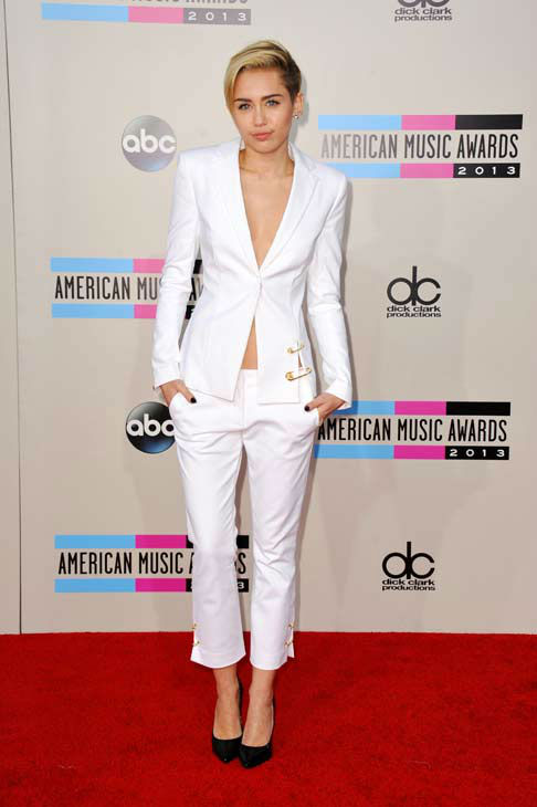 Miley Cyrus arrives at the American Music Awards at the Nokia Theatre L.A. Live on Sunday, Nov. 24, 2013, in Los Angeles.