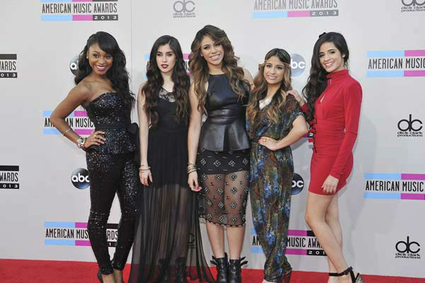 Fifth Harmony arrives at the American Music Awards at the Nokia Theatre L.A. Live on Sunday, Nov. 24, 2013, in Los Angeles.