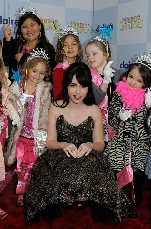 Lily Collins arrives at the premiere of 'Mirror...