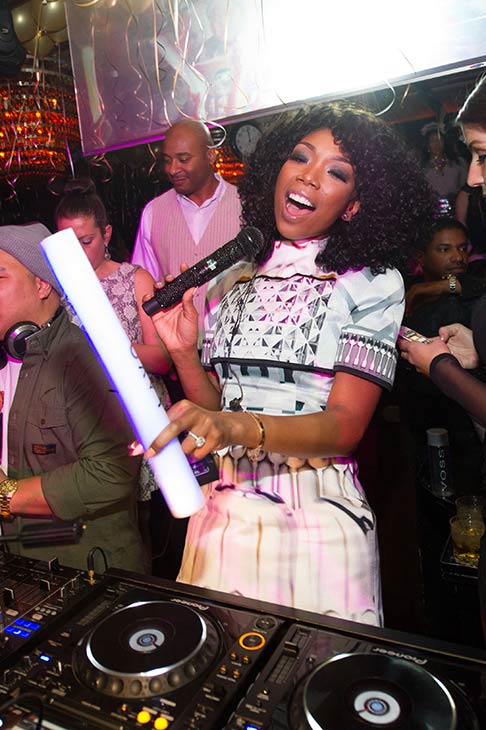 Brandy is seen in the DJ booth at a New Year's...
