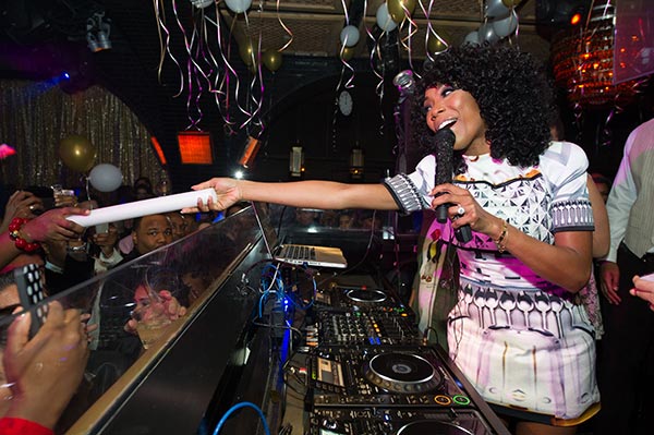 Brandy is seen in the DJ booth at a New Year's Eve party she hosted at the LAVO nightclub in Las Vegas on Dec. 31, 2012. The singer attended the event with fiance Ryan Press.