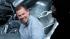 British fashion designer Alexander McQueen waves...