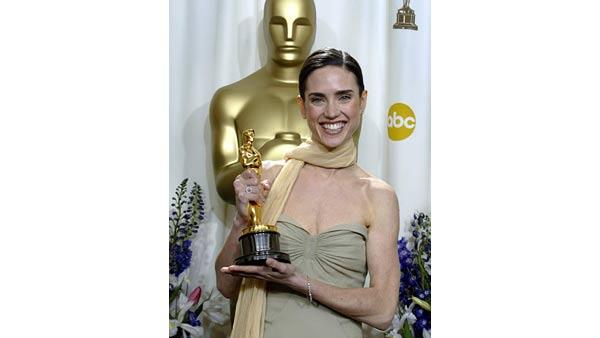 Jennifer Connelly poses with her award for best supporting actress for her work in 'A Beautiful Mind,' at the 74th annual Academy Awards on Sunday, March 24, 2002, in Los Angeles. (AP Photo/Doug Mills)