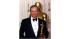 Best Supporting Actor winner Chris Cooper holds...