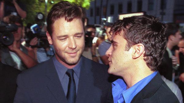 Actors Russell Crowe, left, and Joaquin Phoenix, co-stars of the movie 'Gladiator,' greet each other at a special screening of the film, Monday, May 1, 2000, at the Academy of Motion Picture Arts & Sciences in Beverly Hills, Calif.
