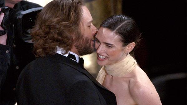 Jennifer Connelly receives a kiss from co-star Russell Crowe after winning best supporting actress for her role in A Beautiful Mind during the 74th annual Academy Awards on Sunday, March 24, 2002, in Los Angeles.