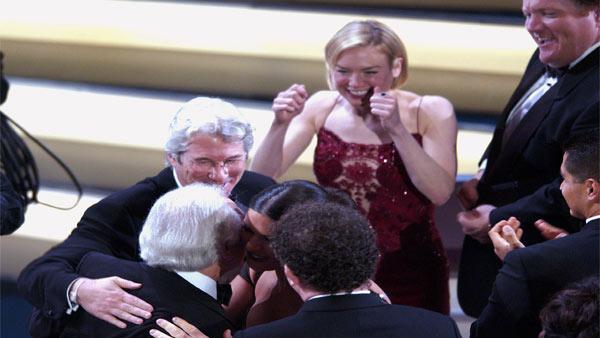 Producer Martin Richards is congratulated by Richard Gere, Catherine Zeta-Jones, John C. Reilly, bottom center, and Renee Zellweger after the film 'Chicago' won for best motion picture of the year at the 75th annual Academy Awards in 2003.