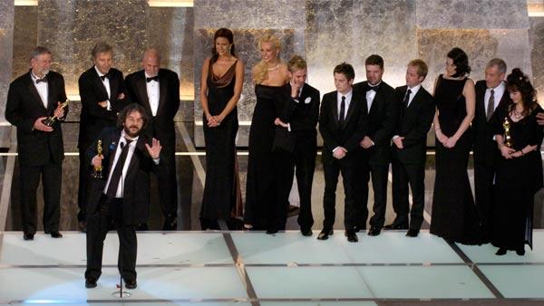 Director Peter Jackson, foreground, accepts the award for best picture for 