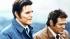Jack Lord, left, as McGarrett and James...