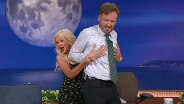 Christina Aguilera teaches Conan OBrien some sexy dance moves from her new film Burlesque on his TBS talk show Conan on Nov. 22, 2010. - Provided courtesy of TBS Christina Aguilera teaches Conan OBrien some sexy dance moves from her new film Burlesque on his TBS talk show Conan on Nov. 22, 2010. - Provided courtesy of TBS
