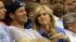 Tony Romo, left, sits with Candice Crawford...