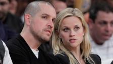 Actress Reese Witherspoon, right, and her fiance, Jim Toth, watch an NBA basketball game between Los Angeles Lakers and the Detroit Pistons in Los Angeles, Tuesday, Jan. 4, 2011. - Provided courtesy of AP / AP Photo/Jae C. Hong