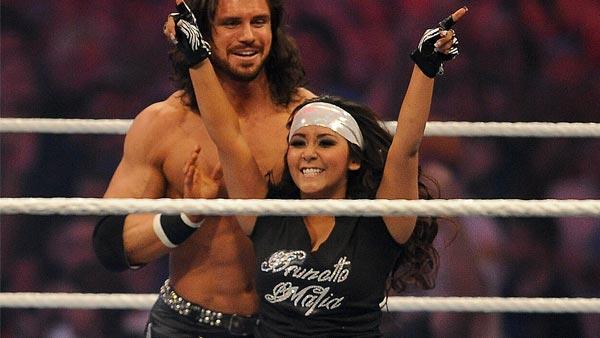 Nicole Snooki Polizzi raises her hands in victory along side WWE Superstar John Morrison after defeating LayCool in front of a sold-out, record crowd of 71,617 during WrestleMania XXVII at the Georgia Dome in Atlanta on Sunday, April 3, 2011. - Provided courtesy of AP Images for WWE/Paul Abell Nicole Snooki Polizzi raises her hands in victory along side WWE Superstar John Morrison after defeating LayCool in front of a sold-out, record crowd of 71,617 during WrestleMania XXVII at the Georgia Dome in Atlanta on Sunday, April 3, 2011. - Provided courtesy of AP Images for WWE/Paul Abell