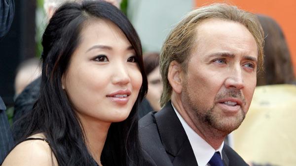 Alice Kim and Nicolas Cage at the ceremony where movie and television producer Jerry Bruckheimer added his hand and footprints in the forecourt of Graumans Chinese Theatre in the Hollywood district of Los Angeles Monday, May 17, 2010. - Provided courtesy of AP / AP Photo/Reed Saxon Alice Kim and Nicolas Cage at the ceremony where movie and television producer Jerry Bruckheimer added his hand and footprints in the forecourt of Graumans Chinese Theatre in the Hollywood district of Los Angeles Monday, May 17, 2010. - Provided courtesy of AP / AP Photo/Reed Saxon