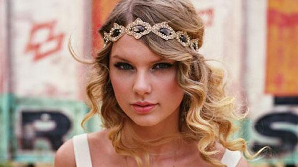Taylor Swift appears in an undated photo from her official website, TaylorSwift.com.