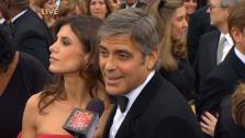 Best Actor nominee George Clooney and girlfriend Elisabetta Canalis walk the red carpet before the 82nd Academy Awards on March 7, 2011 - Provided courtesy of OTRC