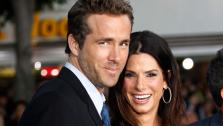 Cast member Ryan Reynolds, left, and Sandra Bullock pose together at the premiere of The Change-Up in Los Angeles, Monday, Aug. 1, 2011. - Provided courtesy of AP / Matt Sayles
