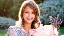 Jessica Alba appears in a photo posted on her Facebook page on July 28, 2011. She is holding a onesie at her baby shower. - Provided courtesy of facebook.com/JessicaAlba