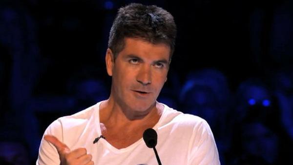 Simon Cowell appears in a scenes from The X Factor, which debuts on FOX on Sept. 21, 2011. / Simon Cowell appears with a puppy in a promotional ad for the UK series The X Factor. - Provided courtesy of FOX / ITV / Fremantle Media Simon Cowell appears in a scenes from The X Factor, which debuts on FOX on Sept. 21, 2011. / Simon Cowell appears with a puppy in a promotional ad for the UK series The X Factor. - Provided courtesy of FOX / ITV / Fremantle Media
