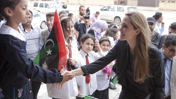 n this photo released by Jason Tanner through the Press Association , actress and U.N. goodwill ambassador Angelina Jolie meets locals in Misrata, Libya Tuesday Oct. 11, 2011. - Provided courtesy of AP / Jason Tanner/ ho n this photo released by Jason Tanner through the Press Association , actress and U.N. goodwill ambassador Angelina Jolie meets locals in Misrata, Libya Tuesday Oct. 11, 2011. - Provided courtesy of AP / Jason Tanner/ ho