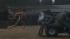 Taylor Lautner runs shirtless in the rain as he...